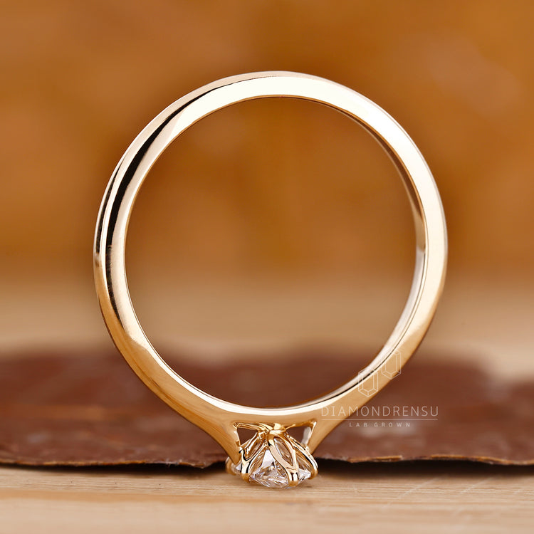 Lab grown diamond solitaire ring with 6 prong claw setting.
