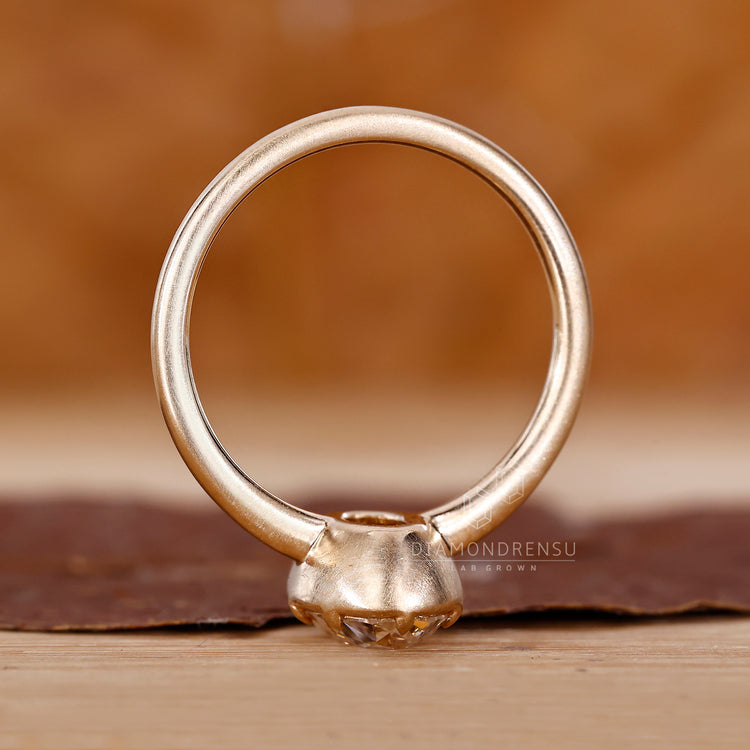 Old European cut engagement ring crafted with handmade yellow gold band.
