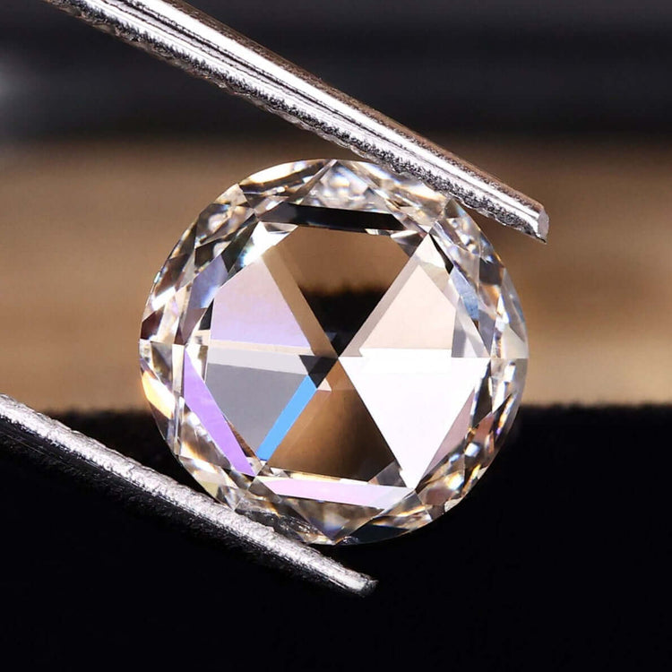 Round rose cut diamond weighs 1.32 carats.
