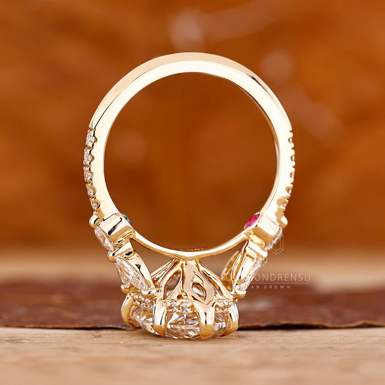 Knife edge shank ring with pear cut diamond and yellow gold.
