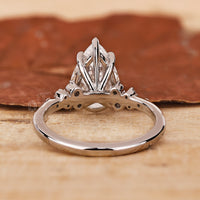 A dazzling 4 Claw Prong Setting showcasing a teardrop ring with radiant brilliance.