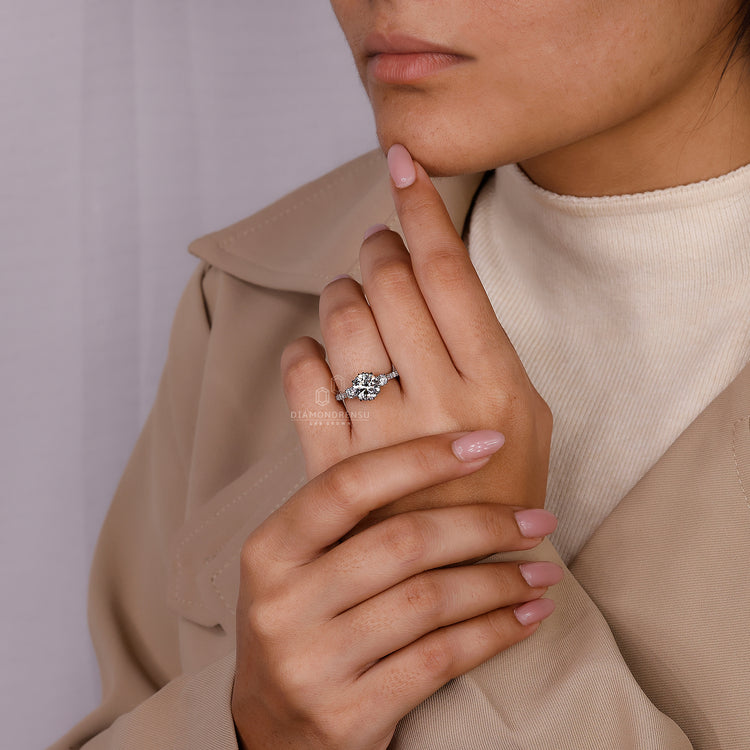 Diamondrensu engagement ring with milgrain details and pave accents.