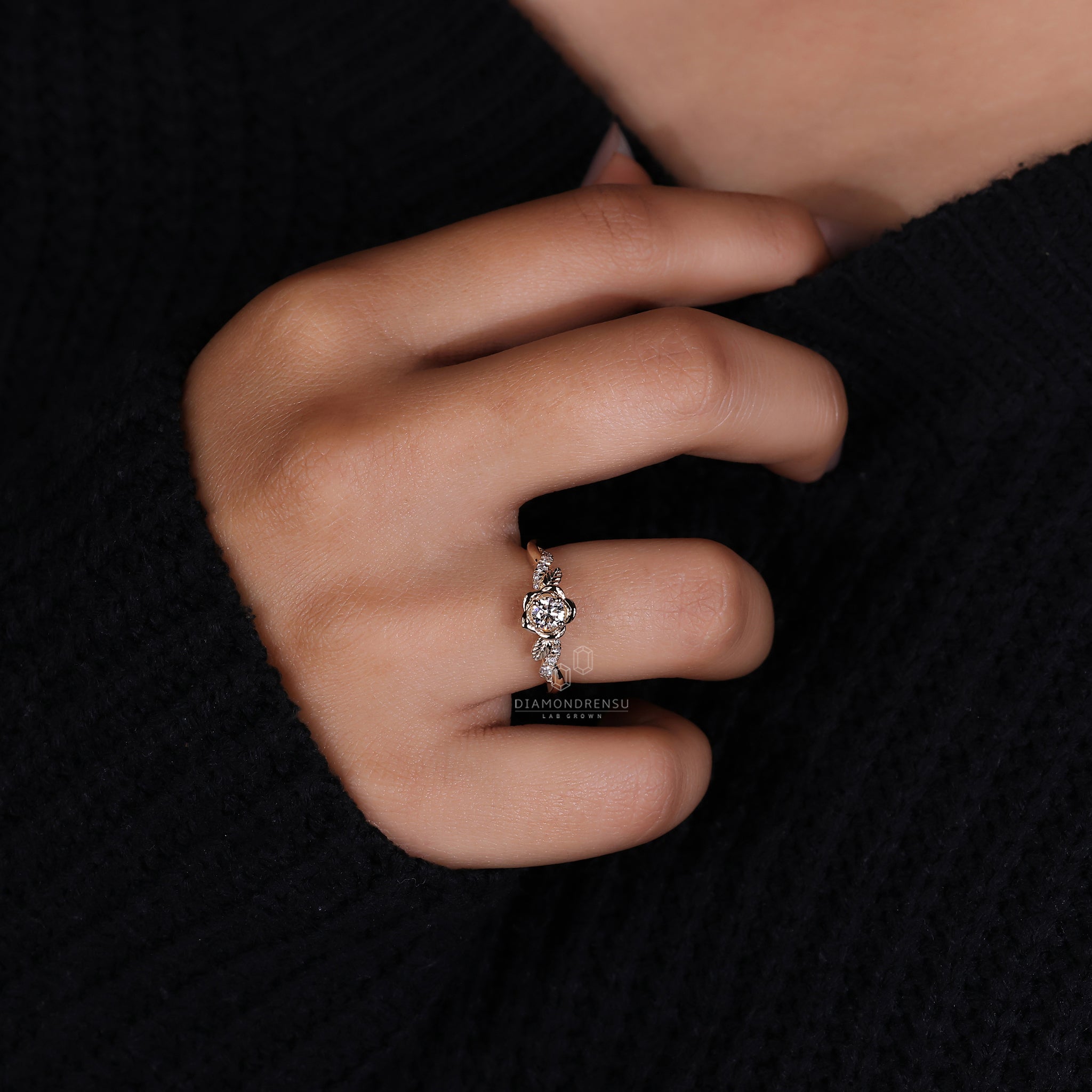 Floral design gold ring with a round diamond and twisted pave band, perfect for nature lovers