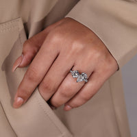 Round diamond pave ring in claw prong setting with white gold ring