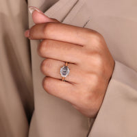 Cathedral ring setting featuring a sparkling three stone emerald cut diamond.
