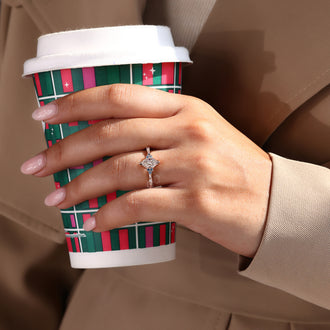 Rose gold engagement ring with a mesmerizing marquise diamond and delicate milgrain setting.
