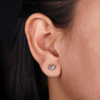 Classic diamond earrings round with a sparkling finish.
