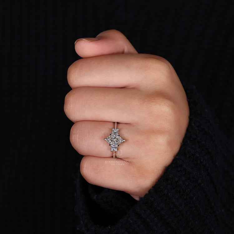 3 Stone Ring with a brilliant center diamond and side stones.