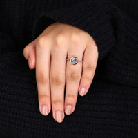 Gold solitaire engagement ring with a bezel set cushion cut diamond for elegance.
