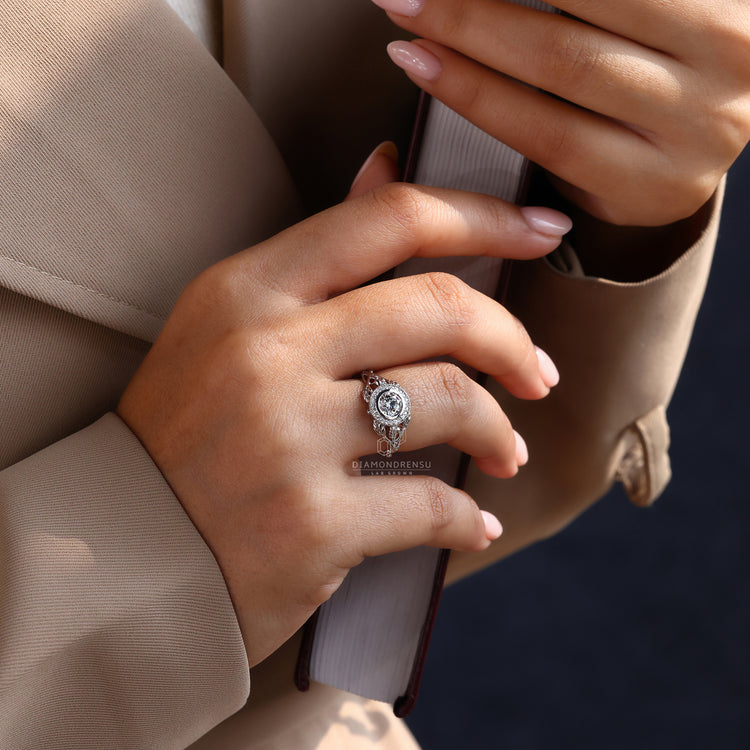 Stunning unique engagement ring with a halo setting, designed for timeless elegance.
