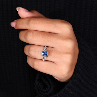 Side stone ring featuring marquise and round side stone accents for added brilliance.
