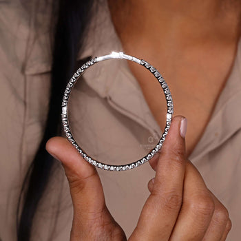 Elegant gold bangle bracelet on a white background