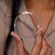 Elegant gold bangle bracelet on a white background