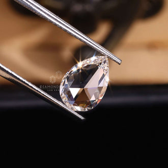 Rose cut diamond shaped in soft pear style.
