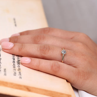 Six claw prong setting round diamond solitaire ring in handmade gold.
