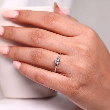 Portuguese cut lab grown diamond ring with side stone style.
