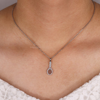 Men's racket charm pendant in white gold with diamond accents.
