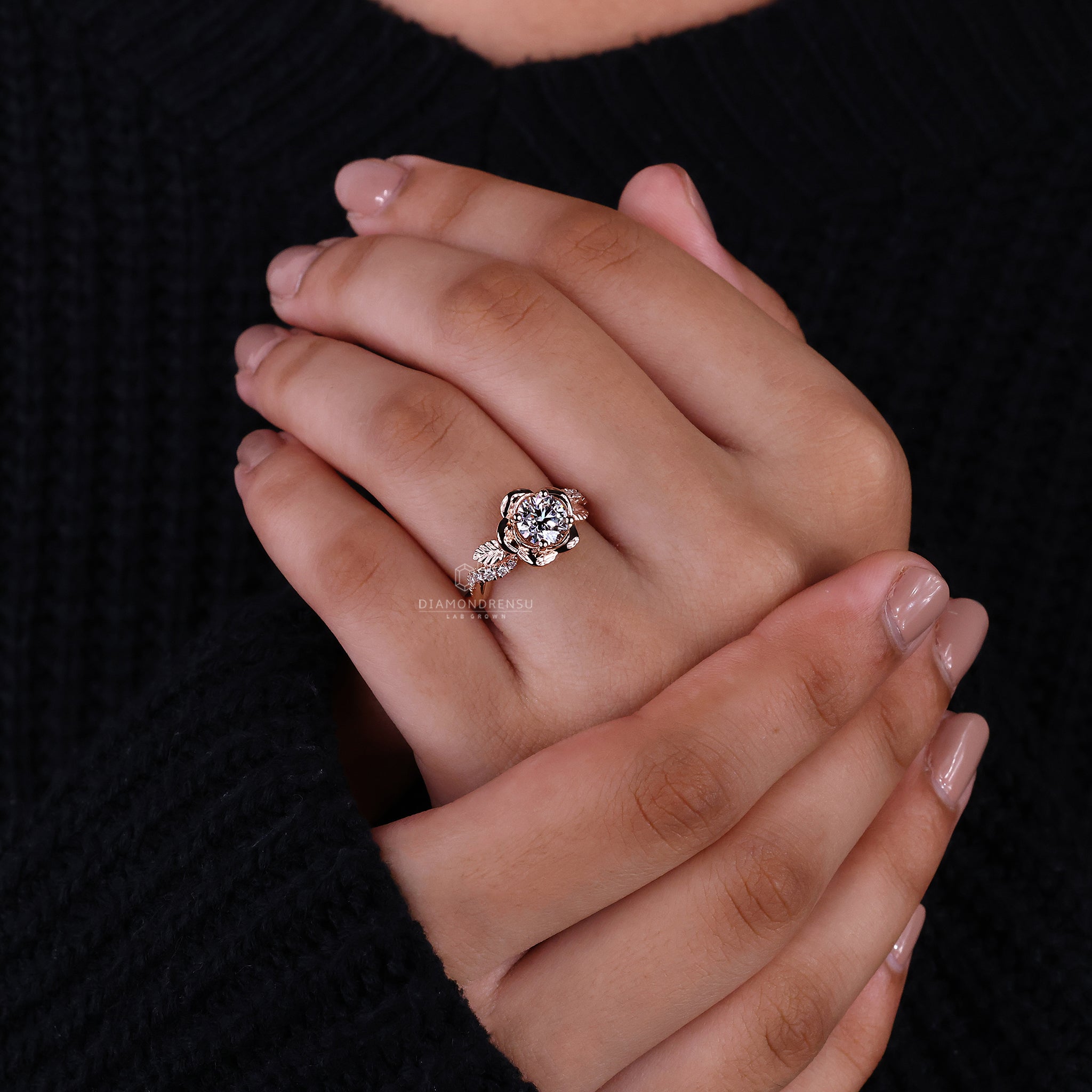 Nature inspired engagement ring with a floral diamond ring design and round cut diamond centerpie