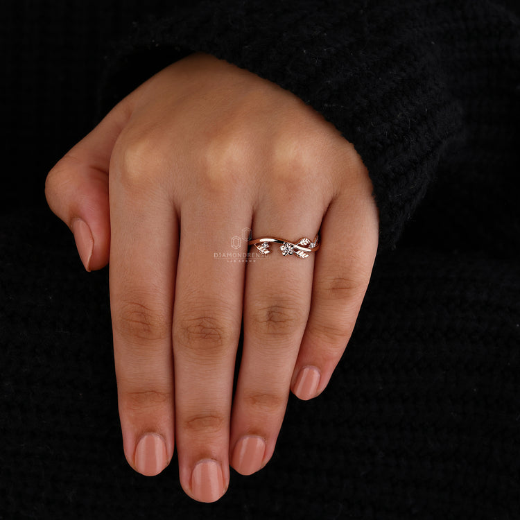 Rose gold band with round cut lab grown diamonds.

