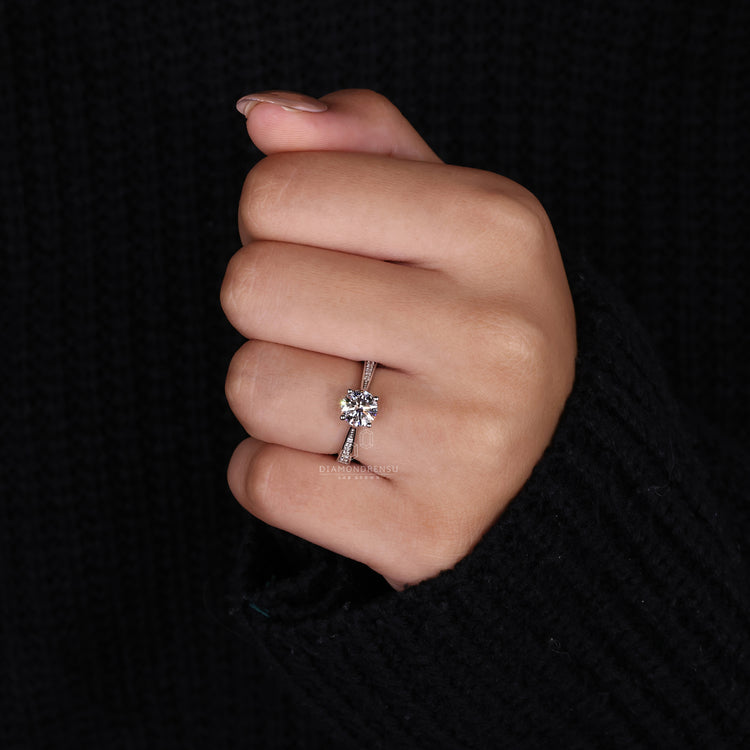 Cathedral Setting Ring with a sparkling round diamond center.