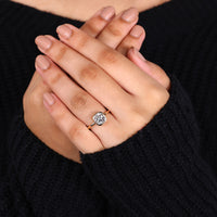 Bezel engagement ring with a cushion diamond for timeless beauty and style.
