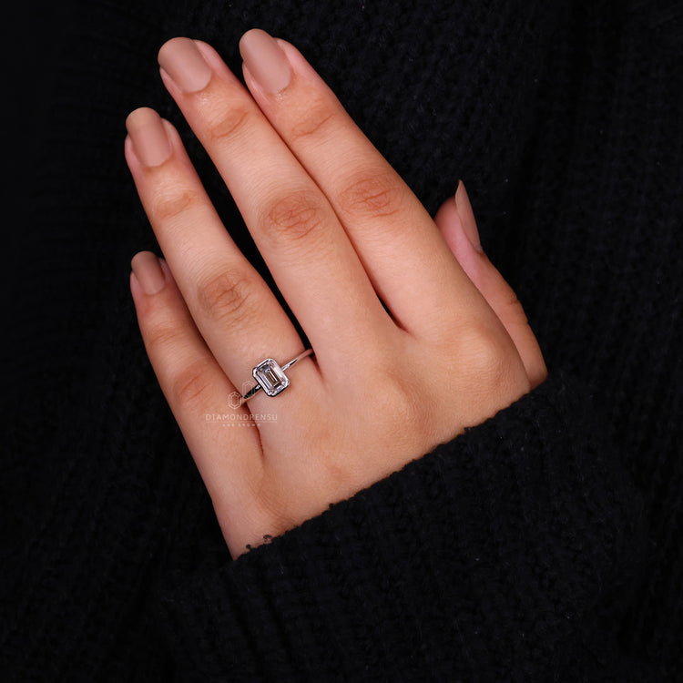 Bezel Set Engagement Ring with an emerald cut diamond.