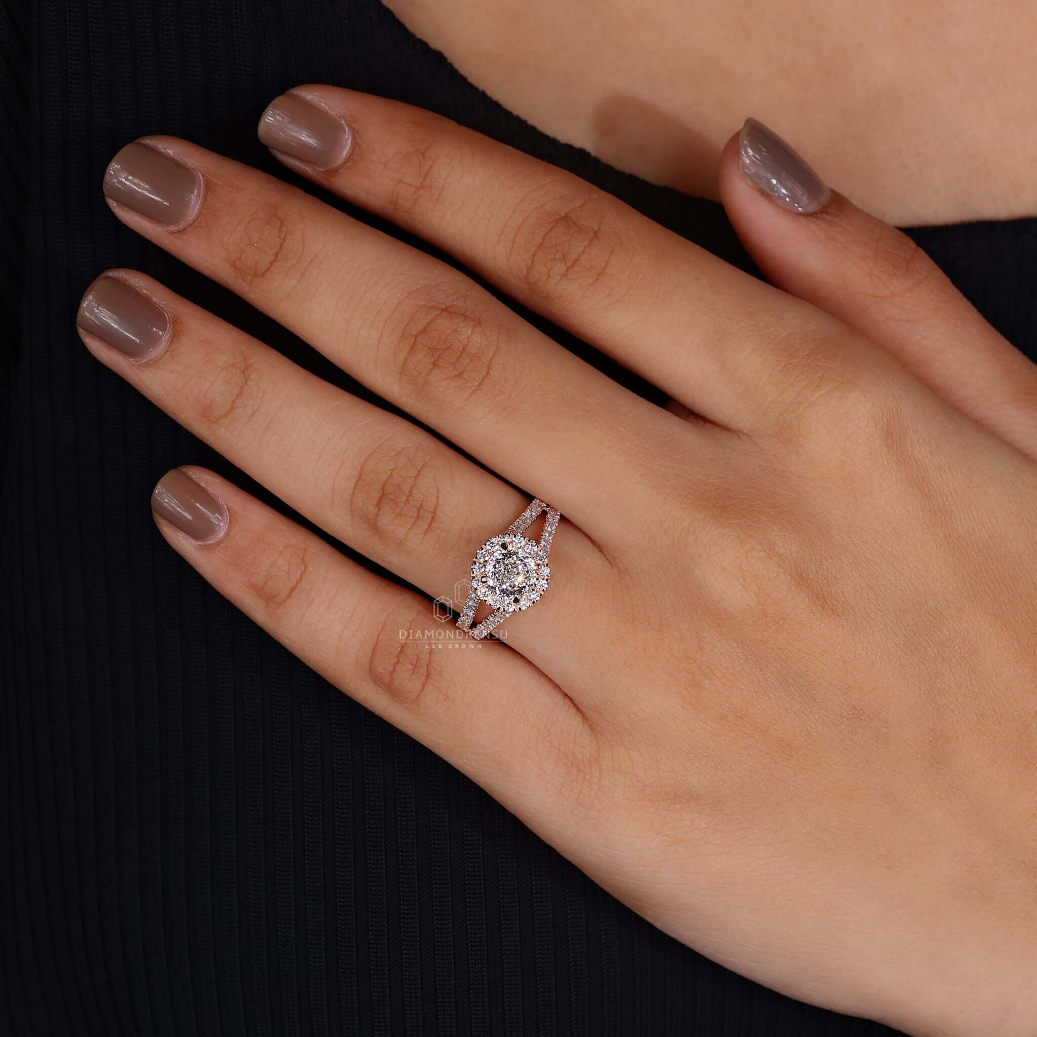 Woman's hand gracefully showcasing the vintage rose gold engagement ring