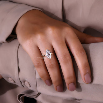 Marquise Solitaire Engagement Ring in a handcrafted setting.
