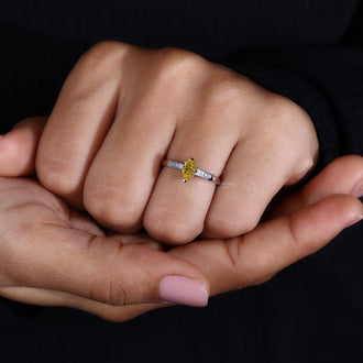 Milgrain Ring featuring an elegant pear shaped diamond.