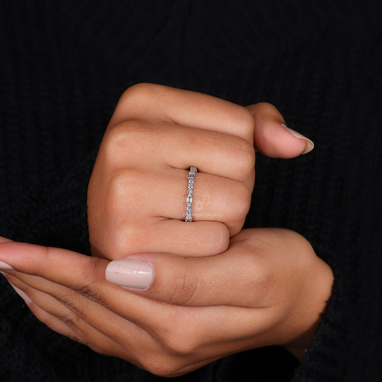 Emerald and Round Cut Band with intricate craftsmanship.
