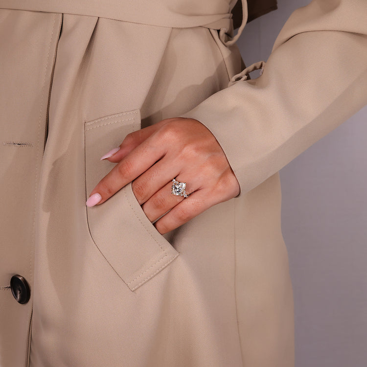 Marquise side stone ring paired with pear cut diamond engagement design.
