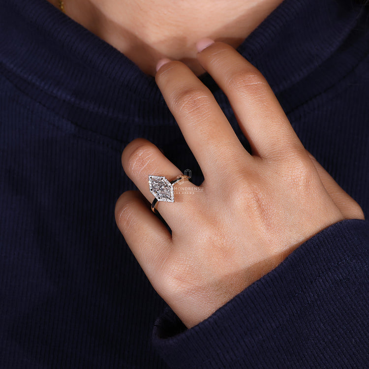 Yellow Gold Ring featuring a radiant, brilliant cut diamond.
