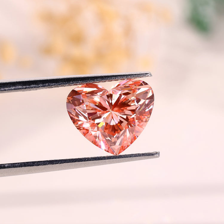 A 4 carat pink heart diamond shines with fancy vivid color and lab grown clarity.
