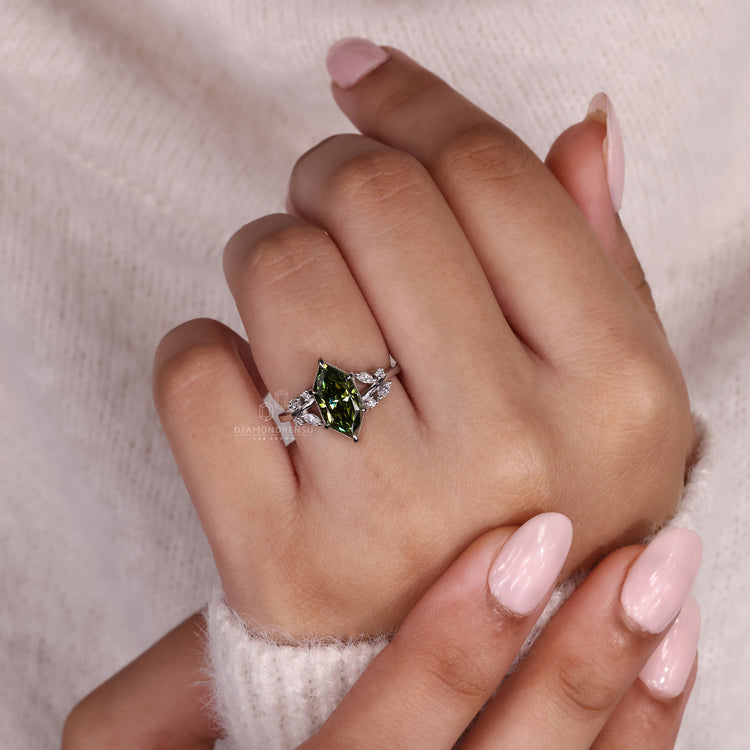 Model showing off a Diamondrensu engagement ring with a Dutch marquise diamond and nature inspired design