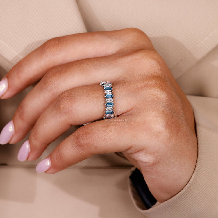 White Gold Wedding Band designed with blue and white diamonds.
