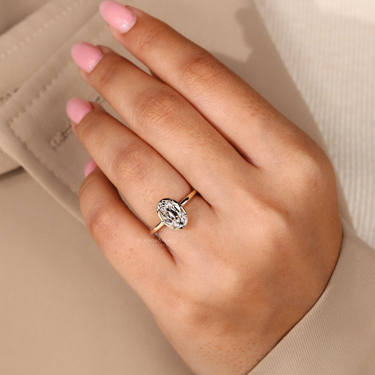 IGI certified oval old European cut diamond engagement ring in yellow gold.
