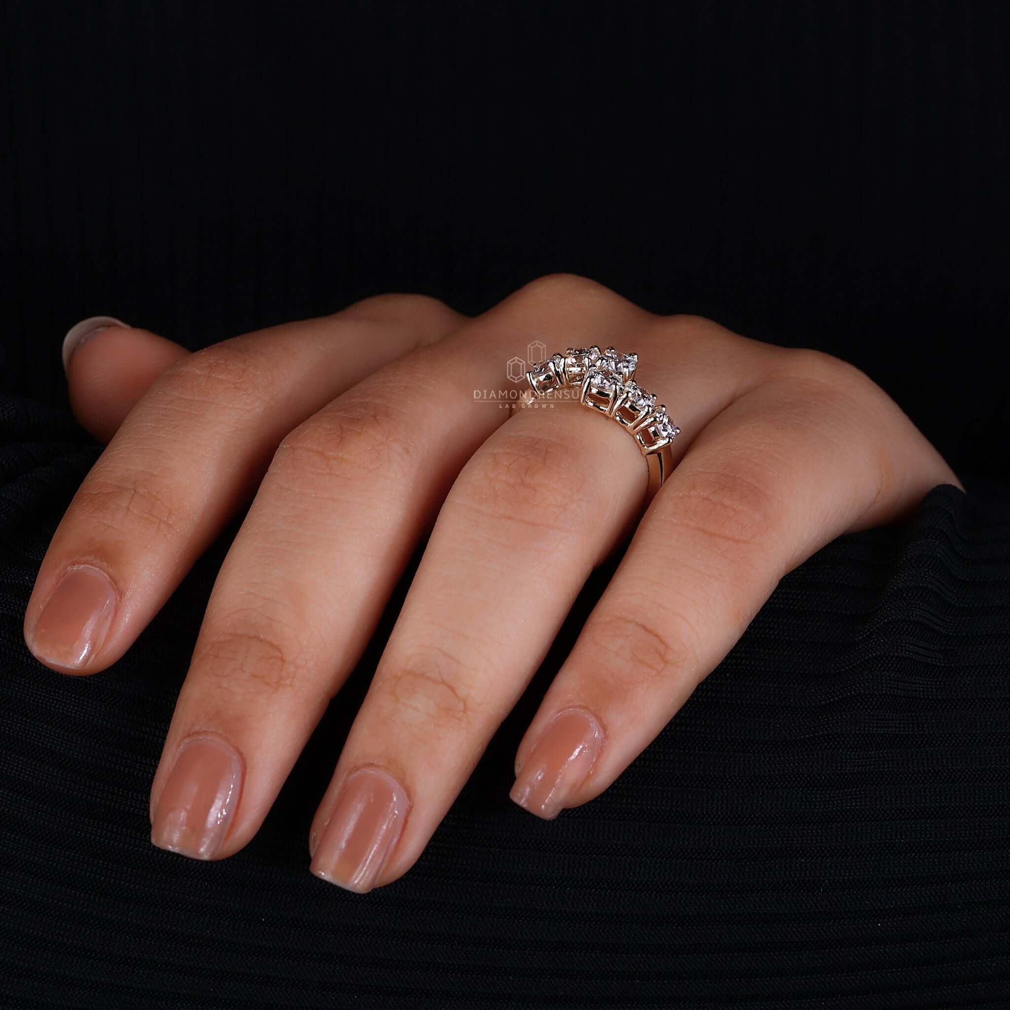 Hand model displaying a bypass ring setting with a round diamond, focusing on its innovative design.