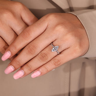 Custom engagement ring with a marquise diamond, made to fit her personal style.
