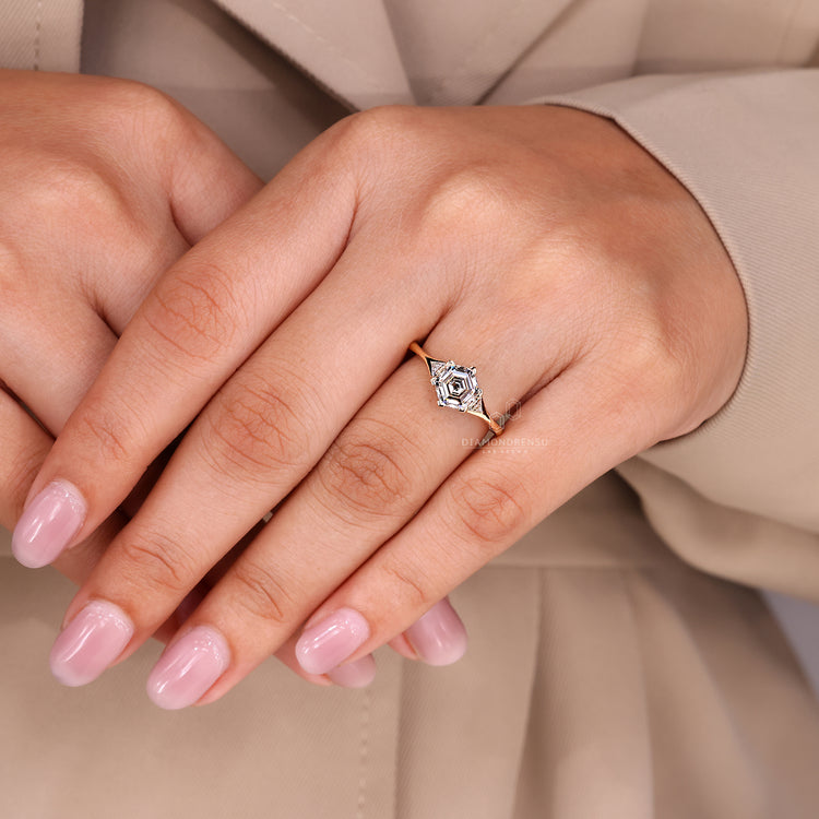 Knife edge shank hexagon step cut diamond ring.
