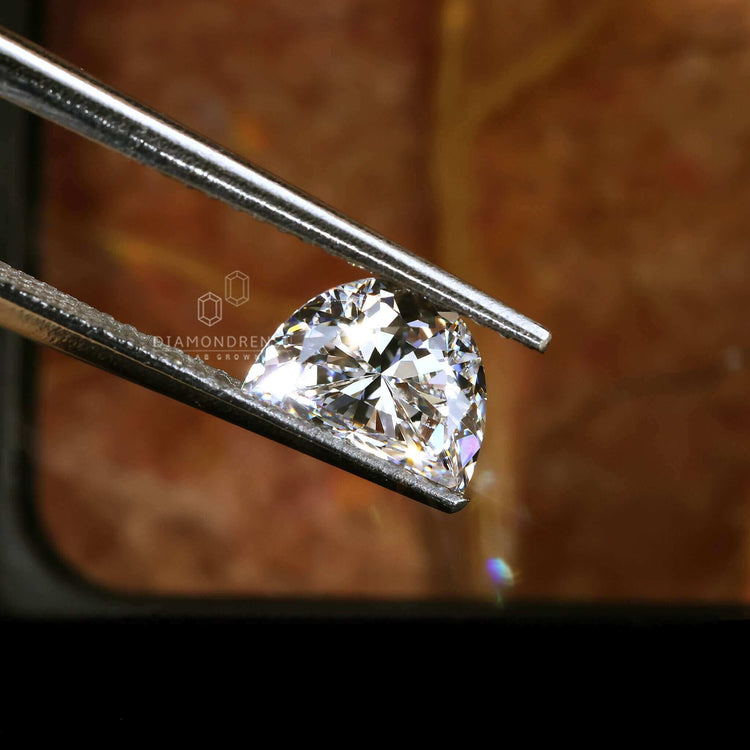 Loose diamond in half moon cut shape.