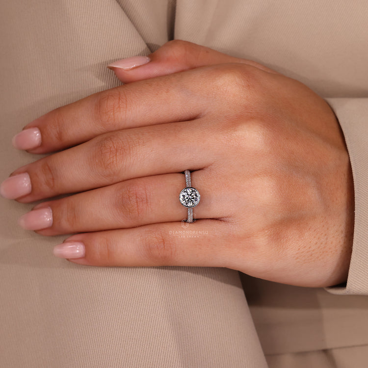 Round cut pave band ring paired with bezel set diamond.

