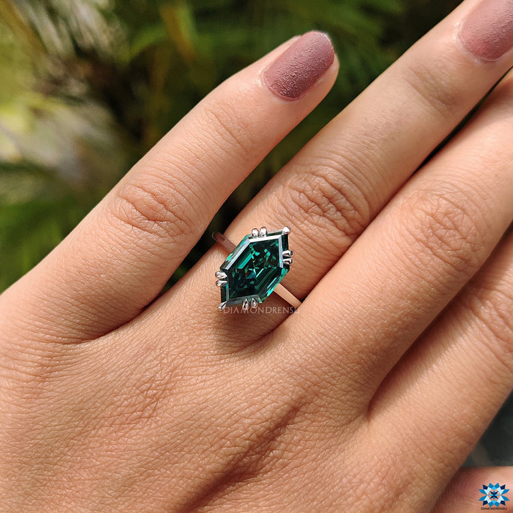 Diamondrensu engagement ring with a custom Dutch Marquise step cut.
