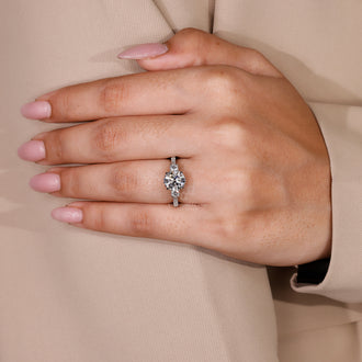 IGI certified 3 stone round cut diamond ring in white gold.
