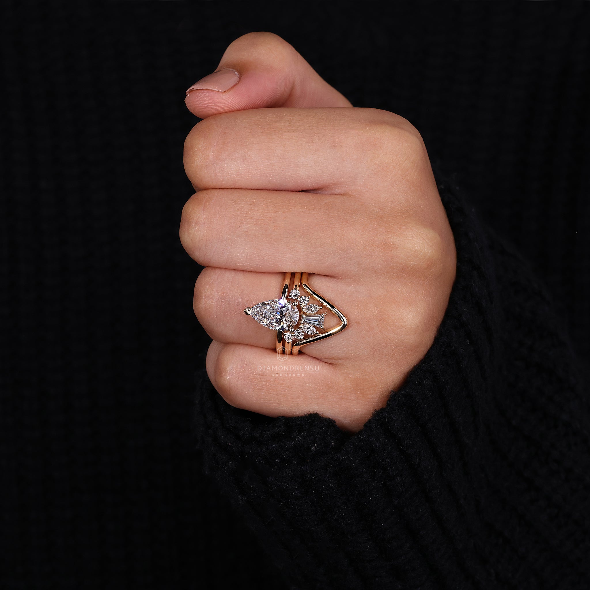 Handmade jewelry trio rings featuring a lab grown diamond engagement ring and curved diamond wedding band