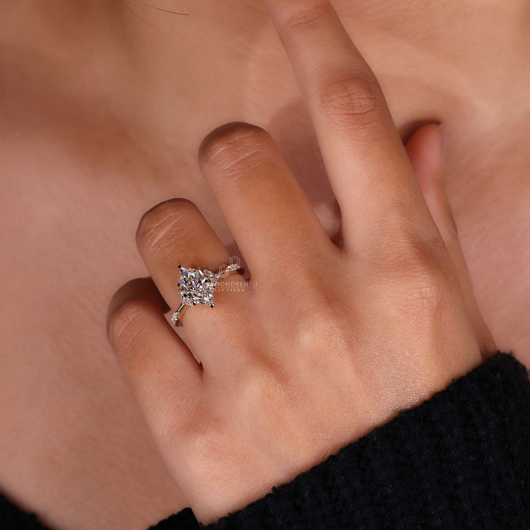 Lab grown diamond marquise engagement ring with classic prong design.
