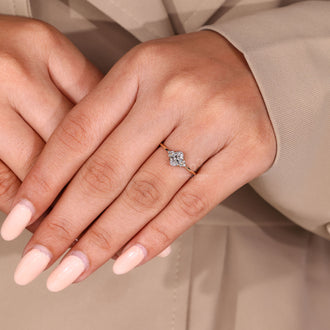 Handmade jewelry ring featuring oval diamond and muse setting details.
