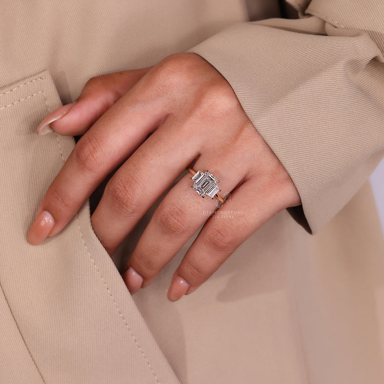 Three stone engagement ring diamond in a timeless emerald cut setting.
