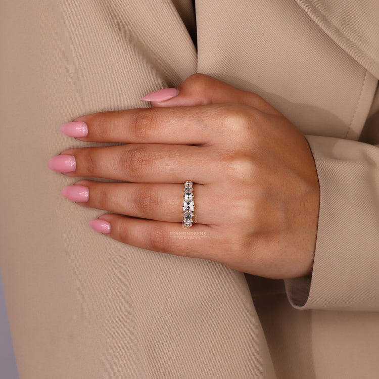 Handmade jewelry featuring a 7 stone diamond band in yellow gold.
