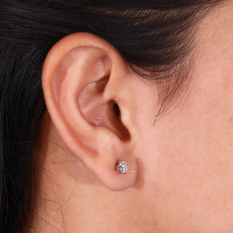 Round diamond stud earrings in a 4 prong setting for secure wear.
