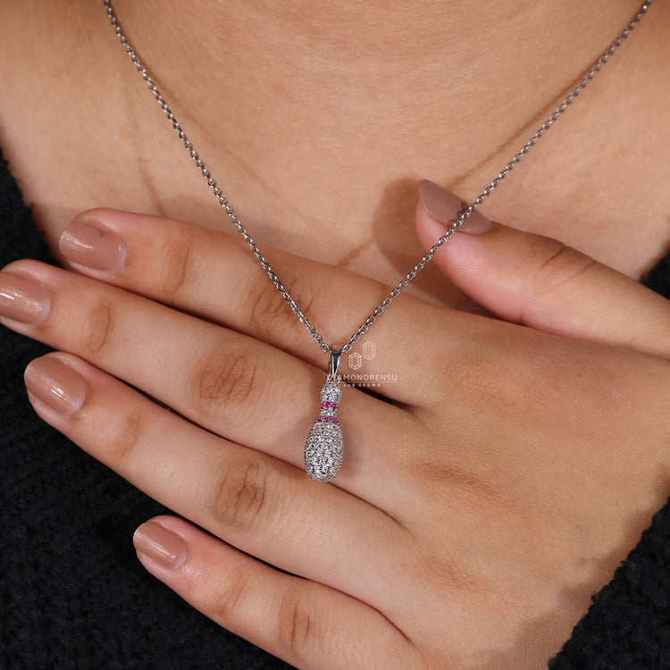 Handmade Bowling Pin charm pendant with diamond accents in white gold.
